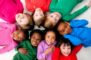 Group of early years children in bright coloured tops