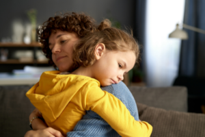 Child hugging their mother